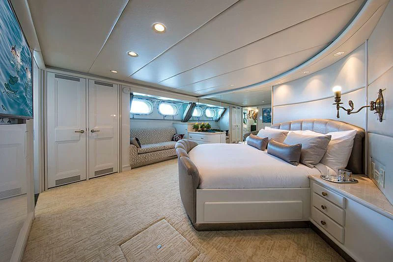 a large bedroom with a large bed aboard GRACE Yacht for Sale
