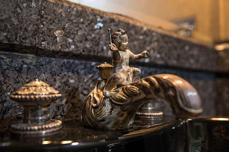 a statue of a person holding a torch aboard GRACE Yacht for Sale