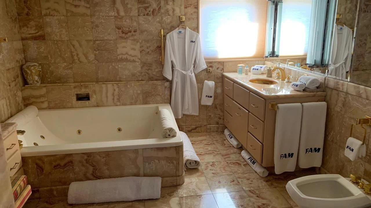 a bathroom with a tub sink and toilet aboard GRACE Yacht for Sale