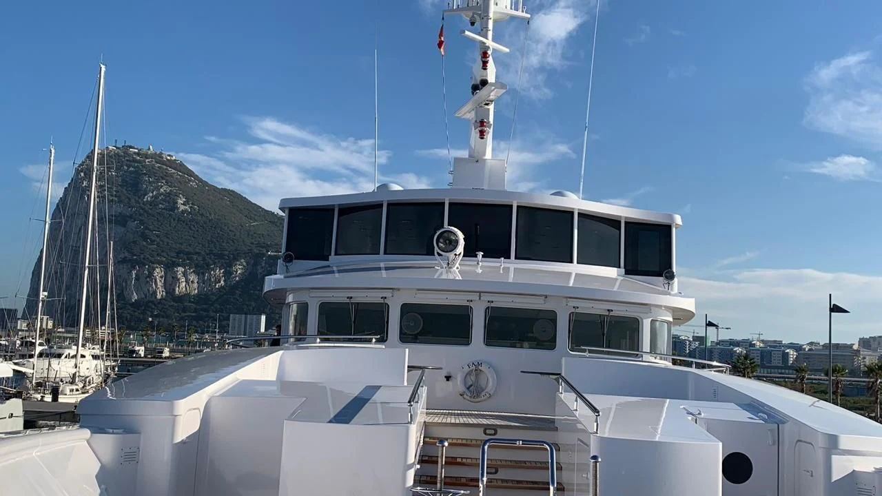 a white boat with a black roof aboard GRACE Yacht for Sale
