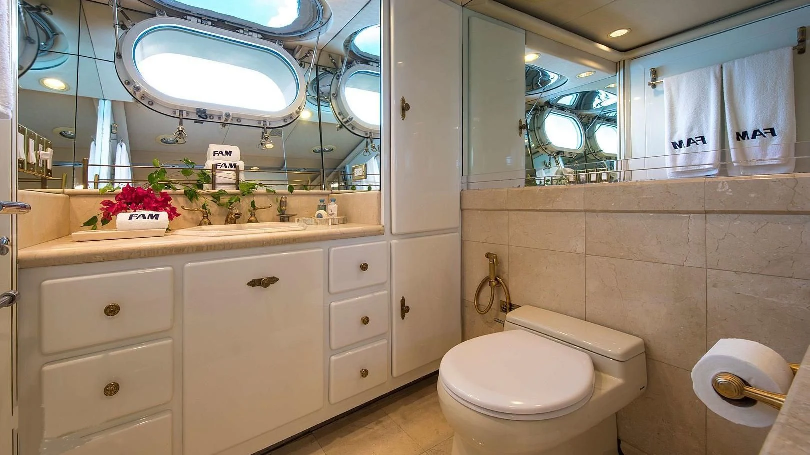 a bathroom with a large mirror aboard GRACE Yacht for Sale