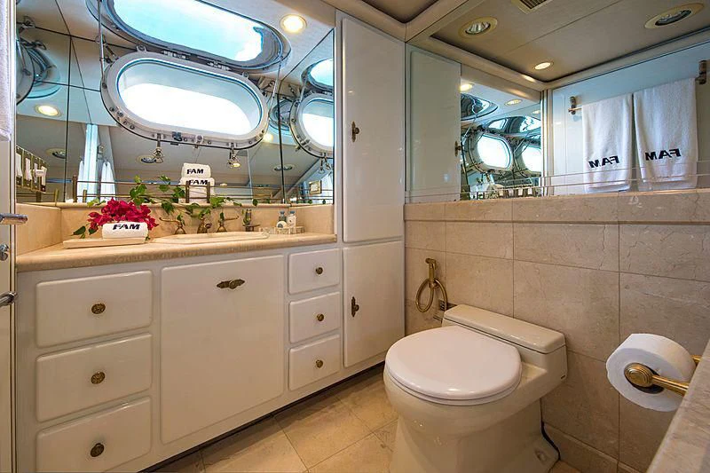a bathroom with a large mirror aboard GRACE Yacht for Sale