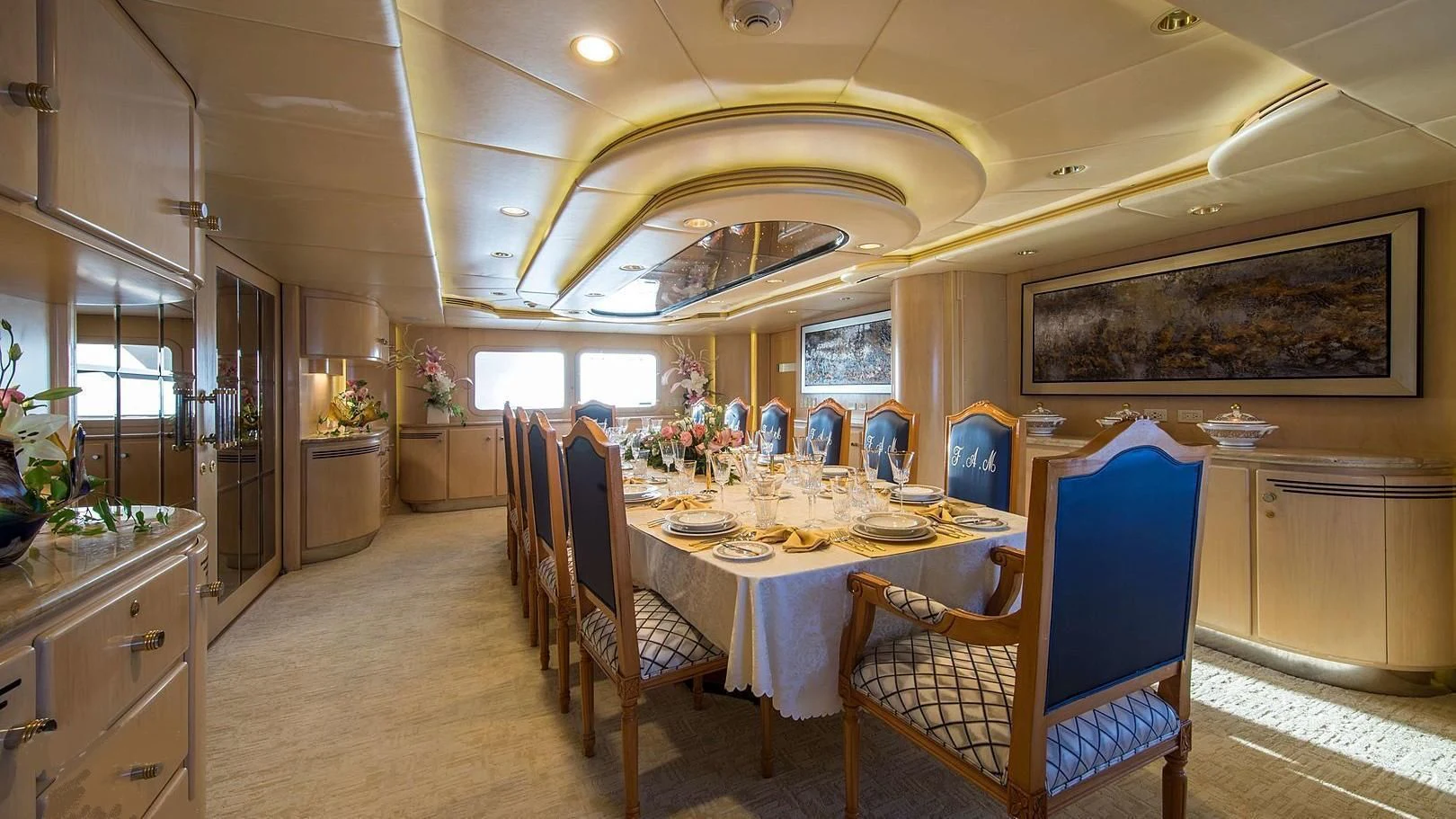 a large dining room with a table and chairs aboard GRACE Yacht for Sale