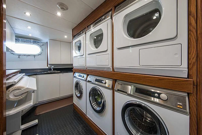 a laundry room with washer and dryer aboard GRACE Yacht for Sale