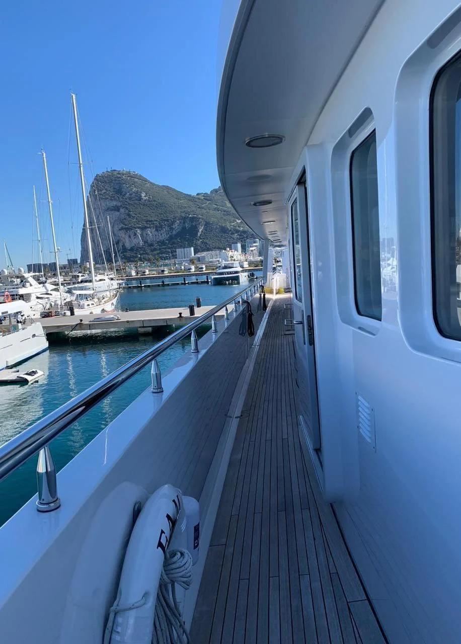a boat is parked on a dock aboard GRACE Yacht for Sale