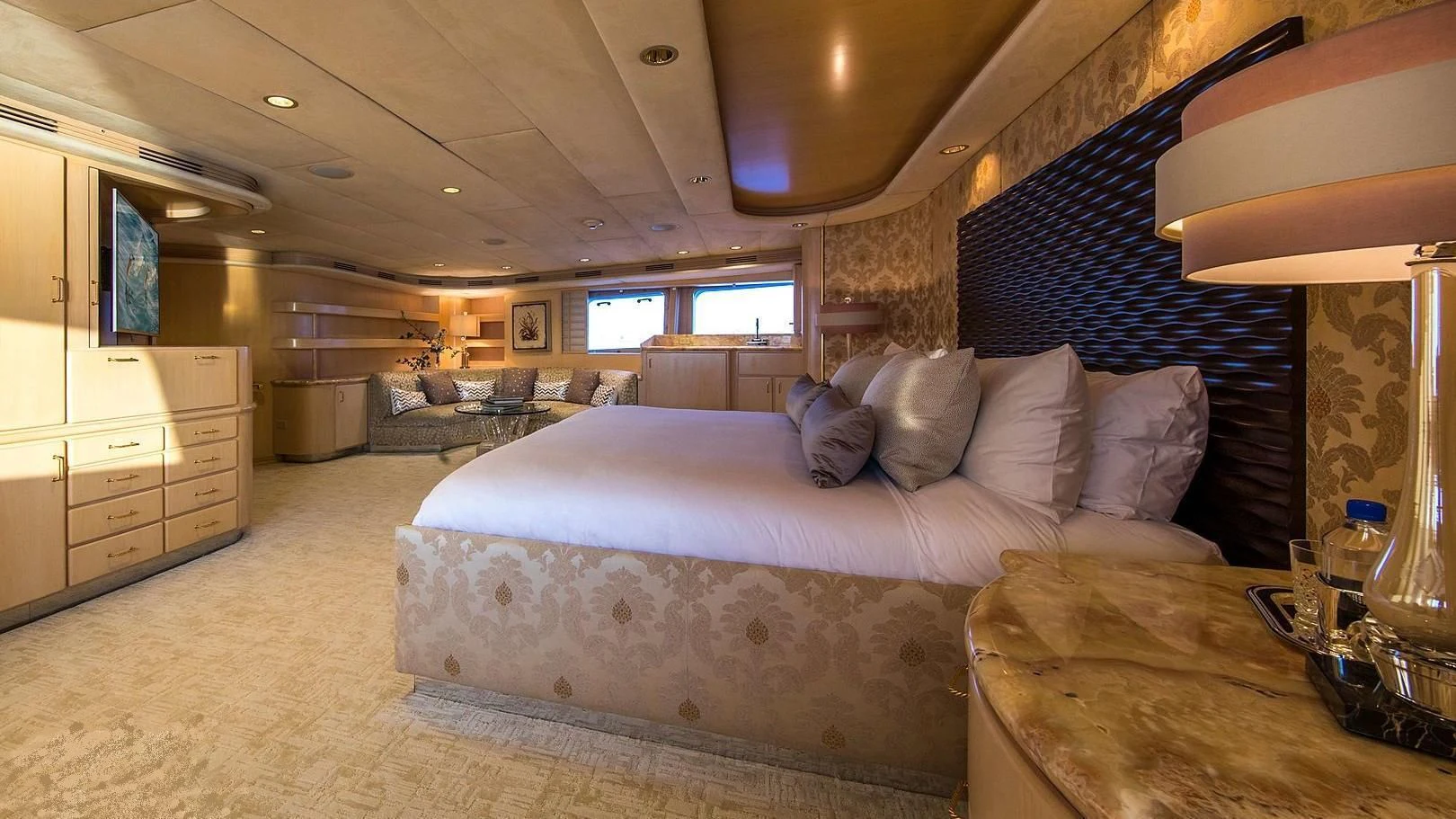 a large bedroom with a bed aboard GRACE Yacht for Sale
