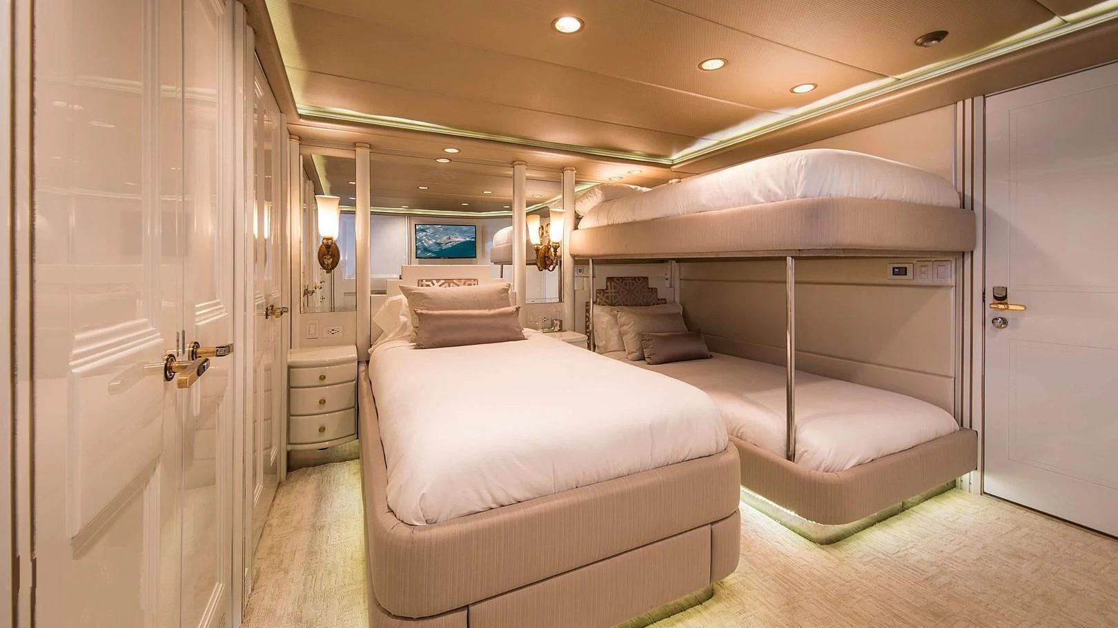 a room with a couple of beds aboard GRACE Yacht for Sale