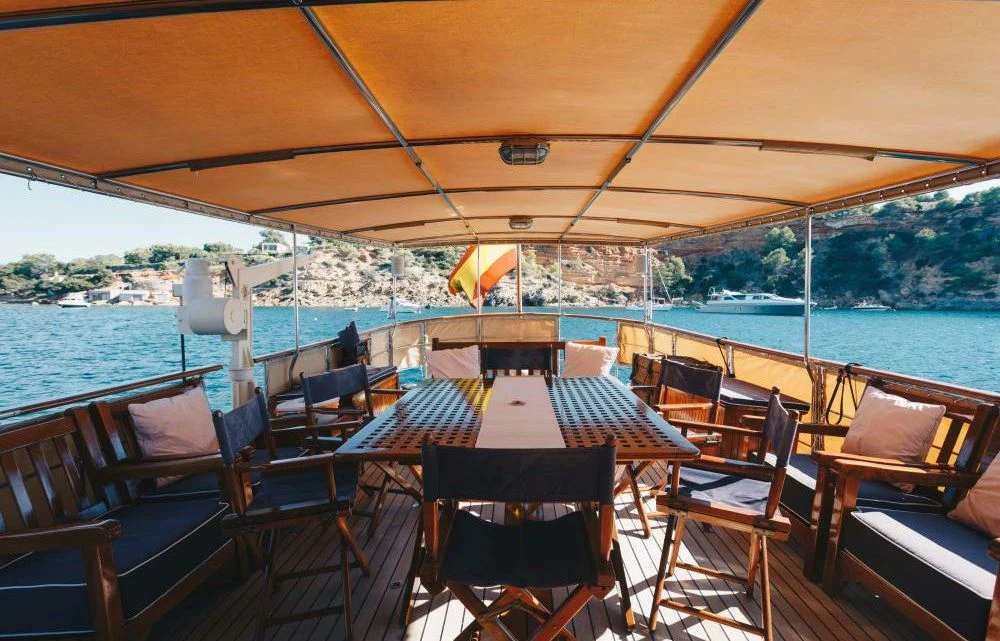 a table and chairs on a boat aboard SILVER CAVALIER Yacht for Sale