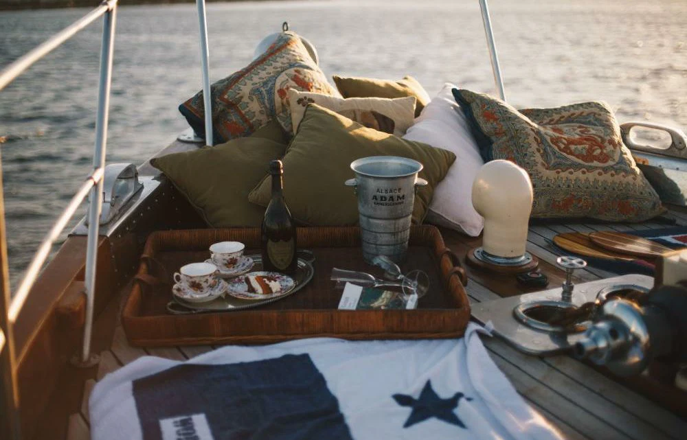 a boat with a tray of food and drinks on it aboard SILVER CAVALIER Yacht for Sale