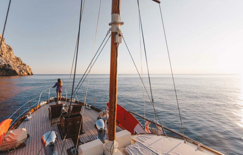 a boat with a person on the front aboard SILVER CAVALIER Yacht for Sale