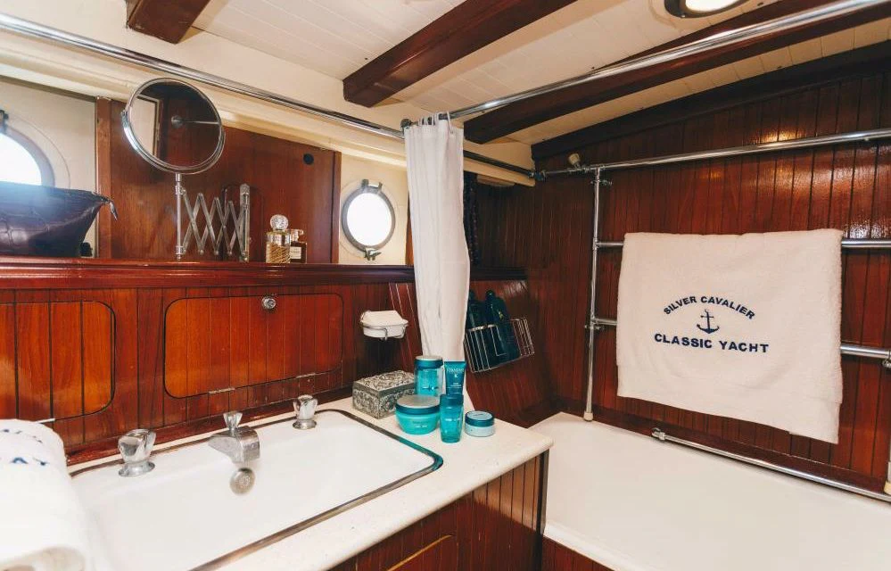 a bathroom with a large mirror aboard SILVER CAVALIER Yacht for Sale