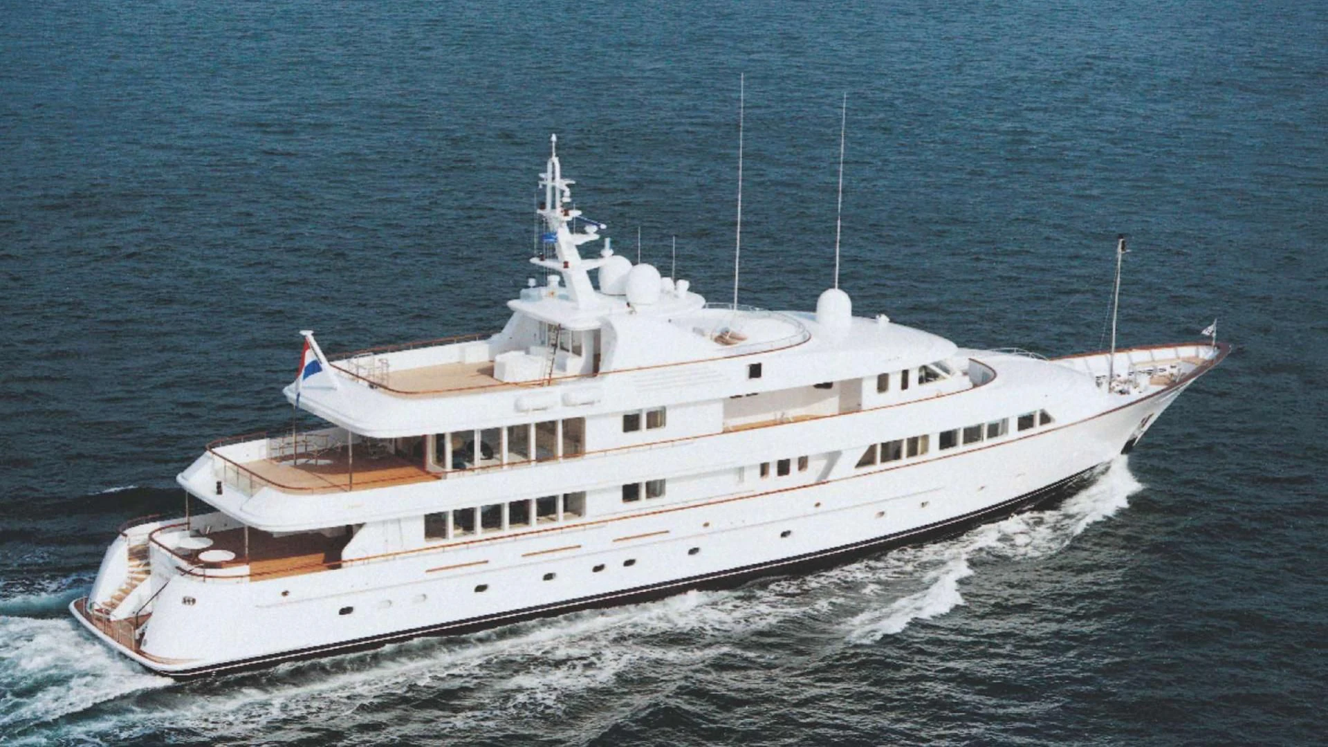 a large white boat aboard OLYMPIA Yacht for Sale