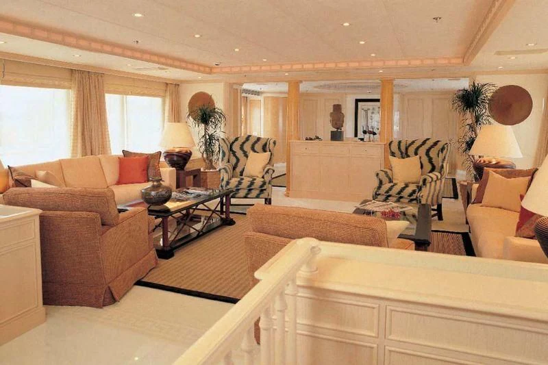 a living room with a couch and a coffee table aboard OLYMPIA Yacht for Sale