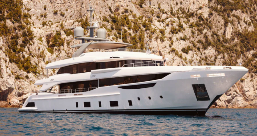 a white yacht on the water aboard EMUNA Yacht for Sale