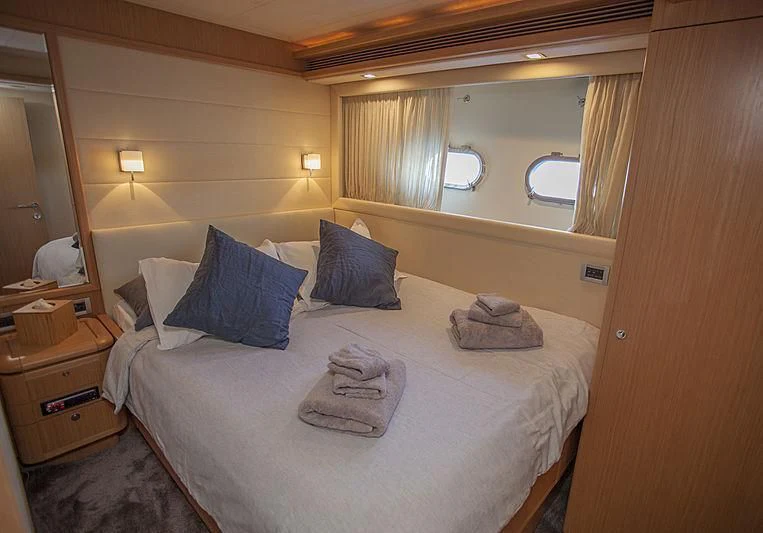 a hotel room with a bed aboard YOYITA Yacht for Sale