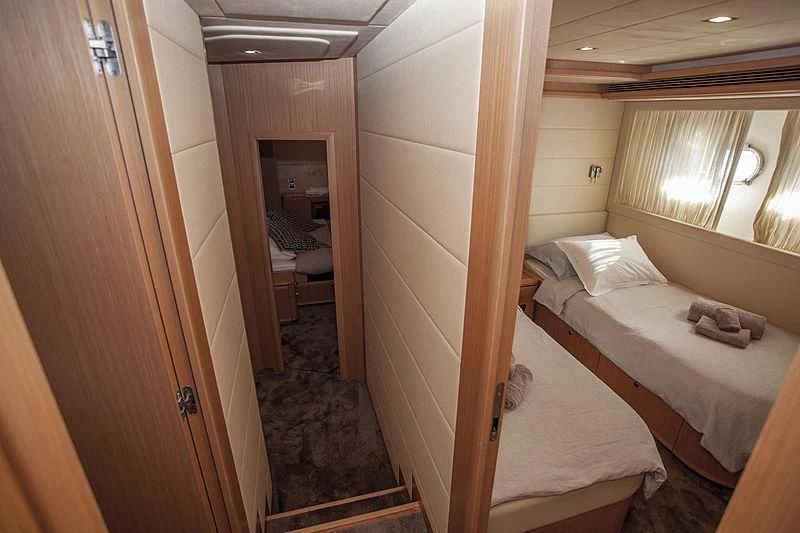 a room with two beds aboard YOYITA Yacht for Sale