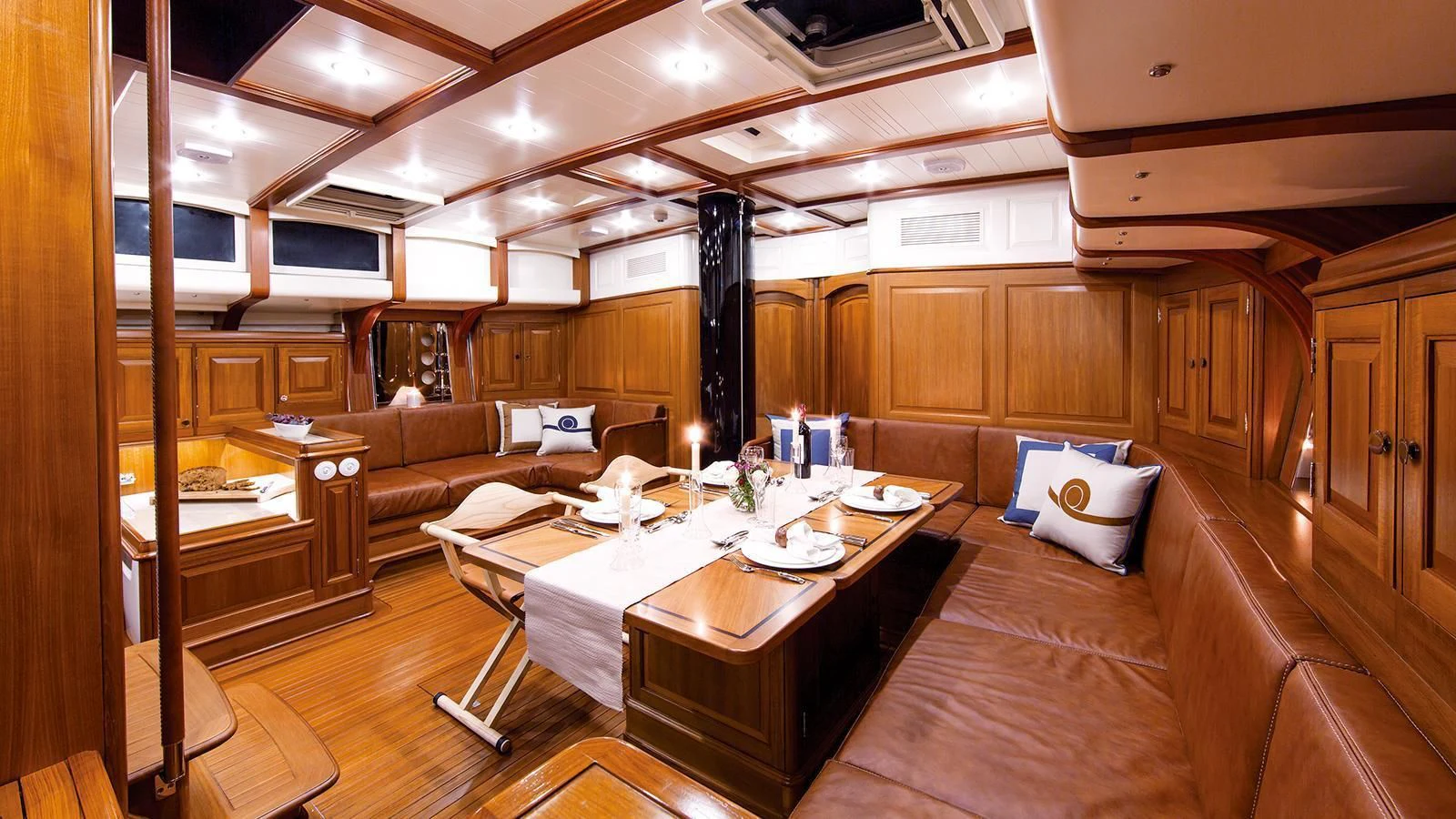 a large room with a table and chairs aboard TEMPUS FUGIT Yacht for Sale