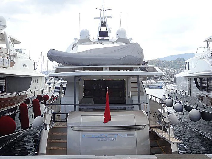 a boat is parked in a harbor aboard OZONE Yacht for Sale