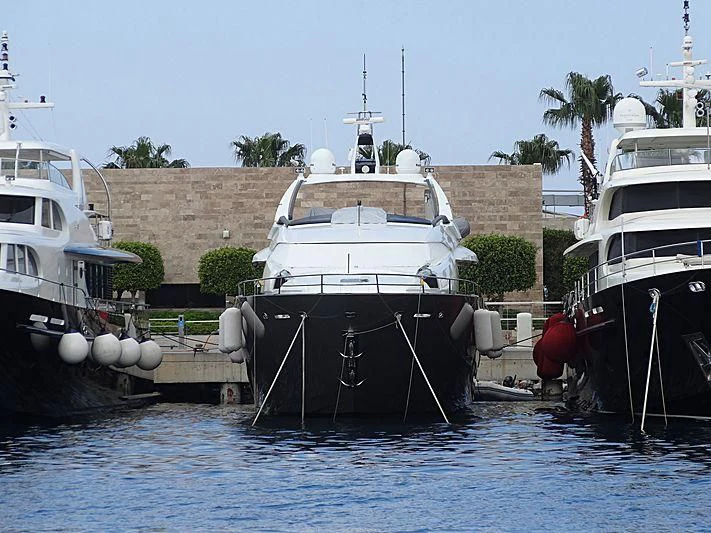 boats docked in a harbor aboard OZONE Yacht for Sale