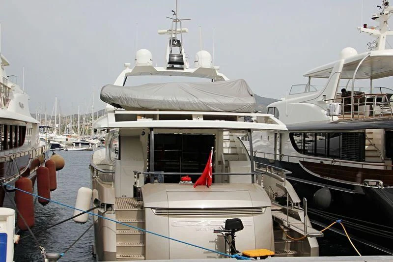a boat docked at a pier aboard OZONE Yacht for Sale
