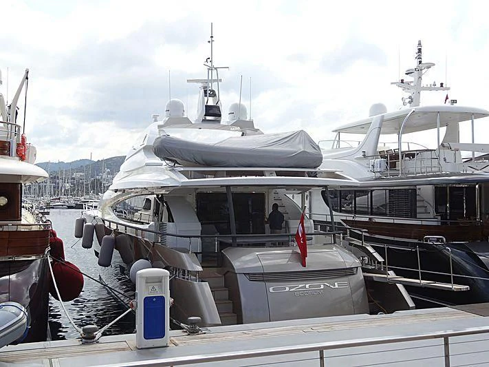 a boat docked at a pier aboard OZONE Yacht for Sale