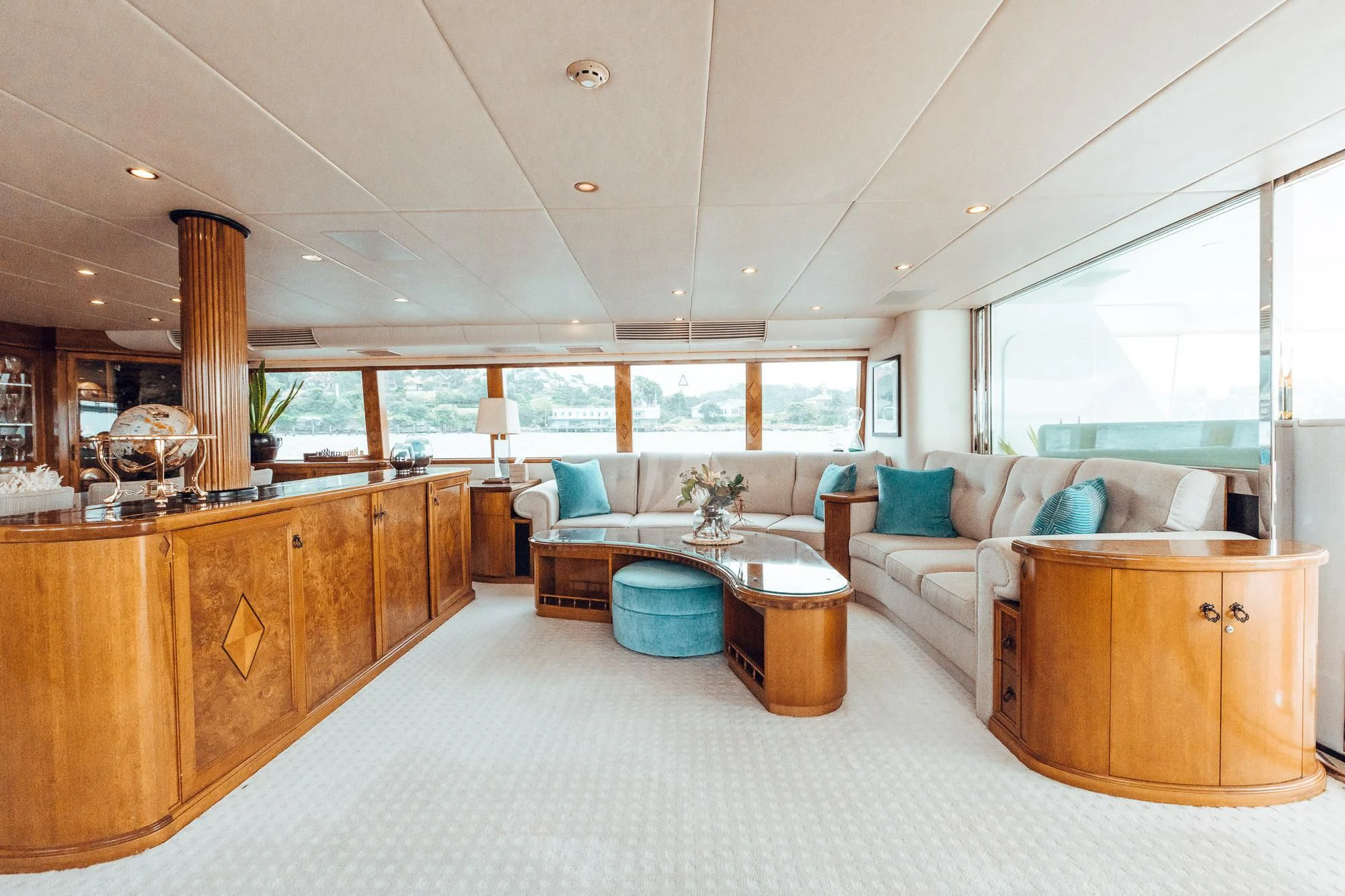 a large living room with a large window aboard OSCAR II Yacht for Sale