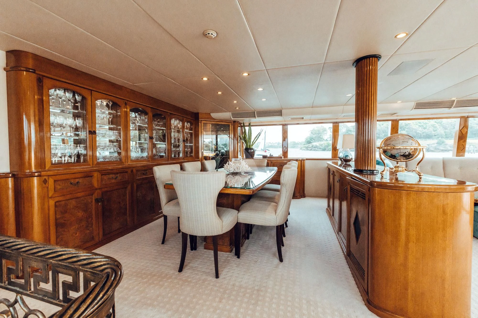 a large kitchen with a dining table aboard OSCAR II Yacht for Sale