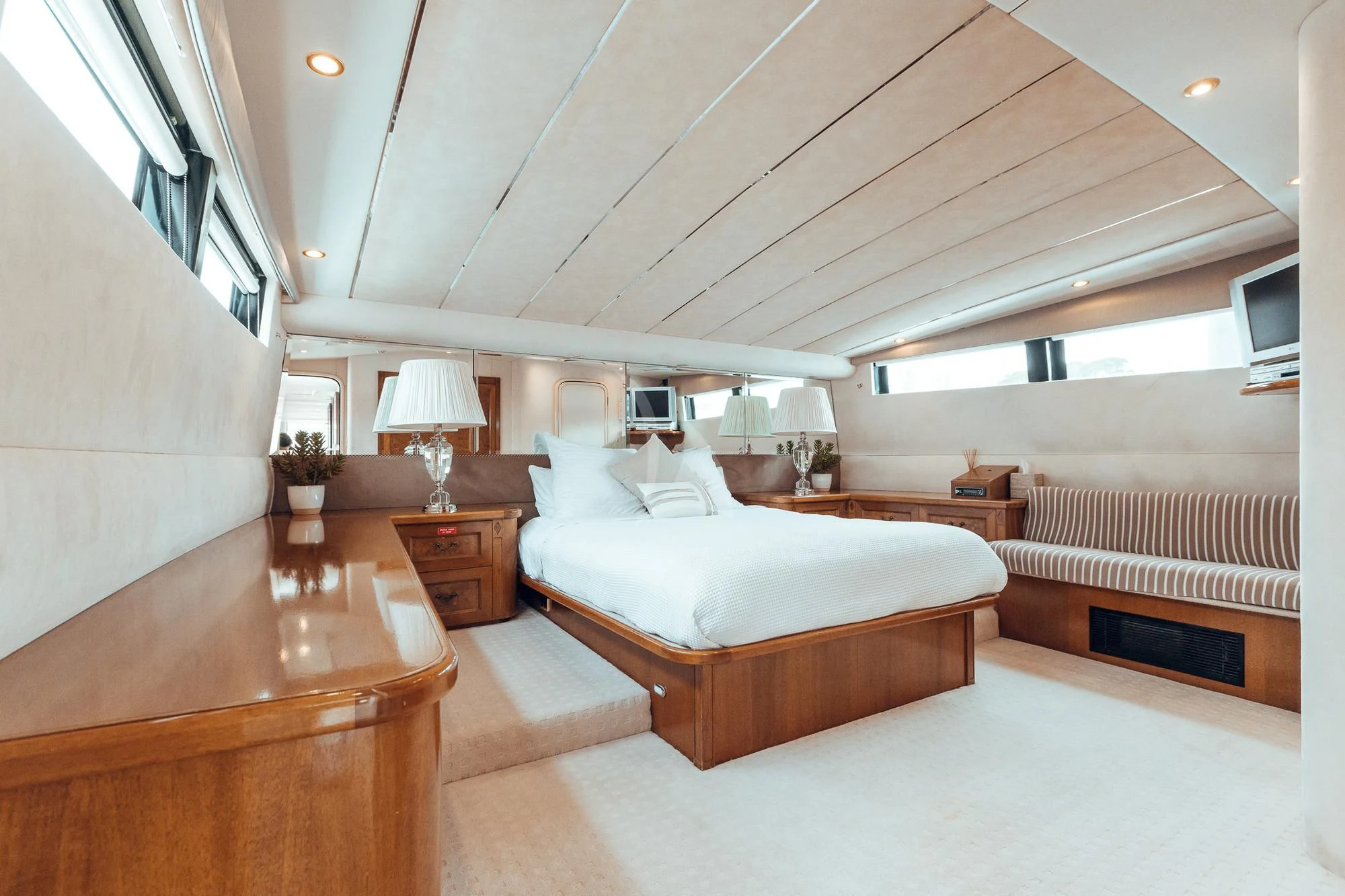 a room with a bed and a desk aboard OSCAR II Yacht for Sale