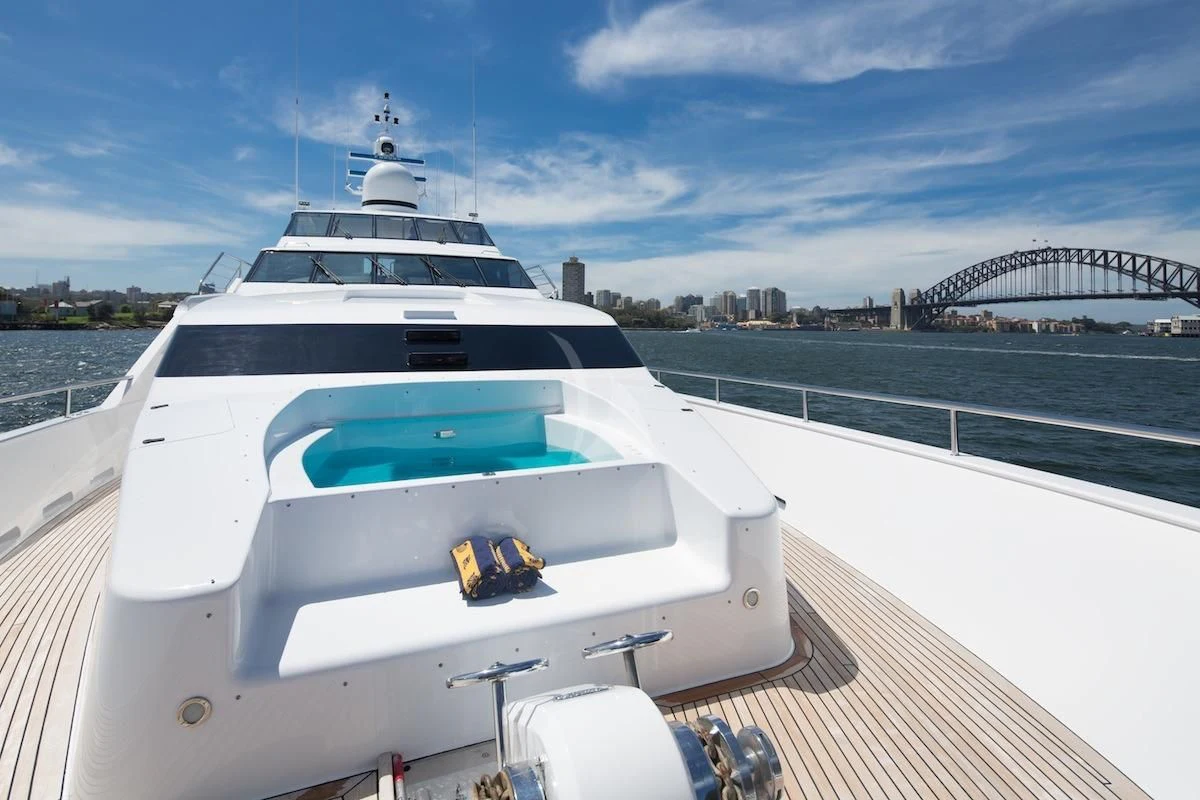 a white yacht on a deck aboard OSCAR II Yacht for Sale