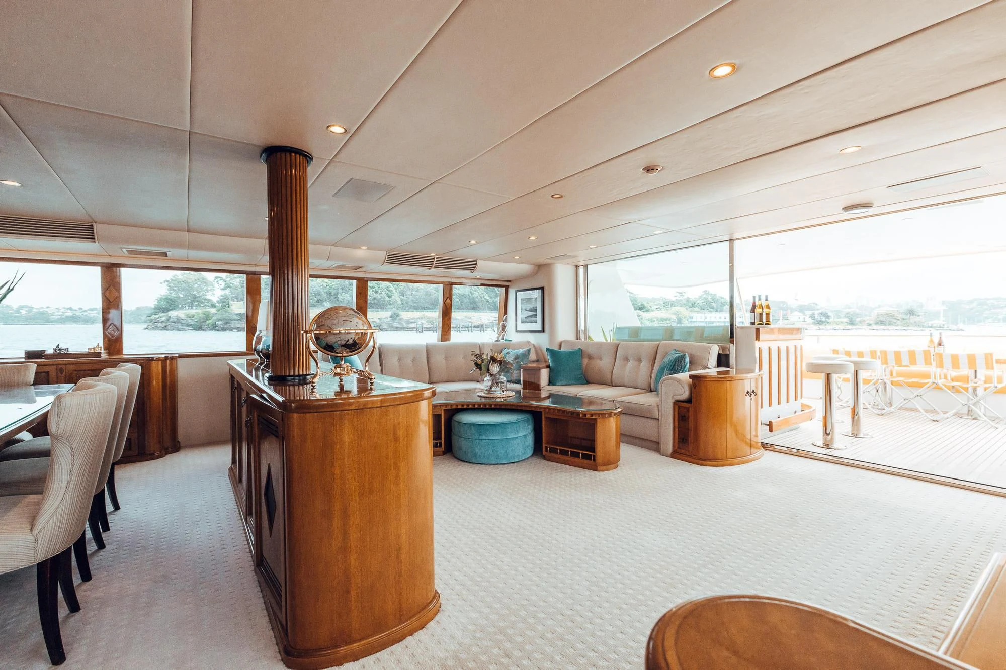 a large living room with a large window aboard OSCAR II Yacht for Sale