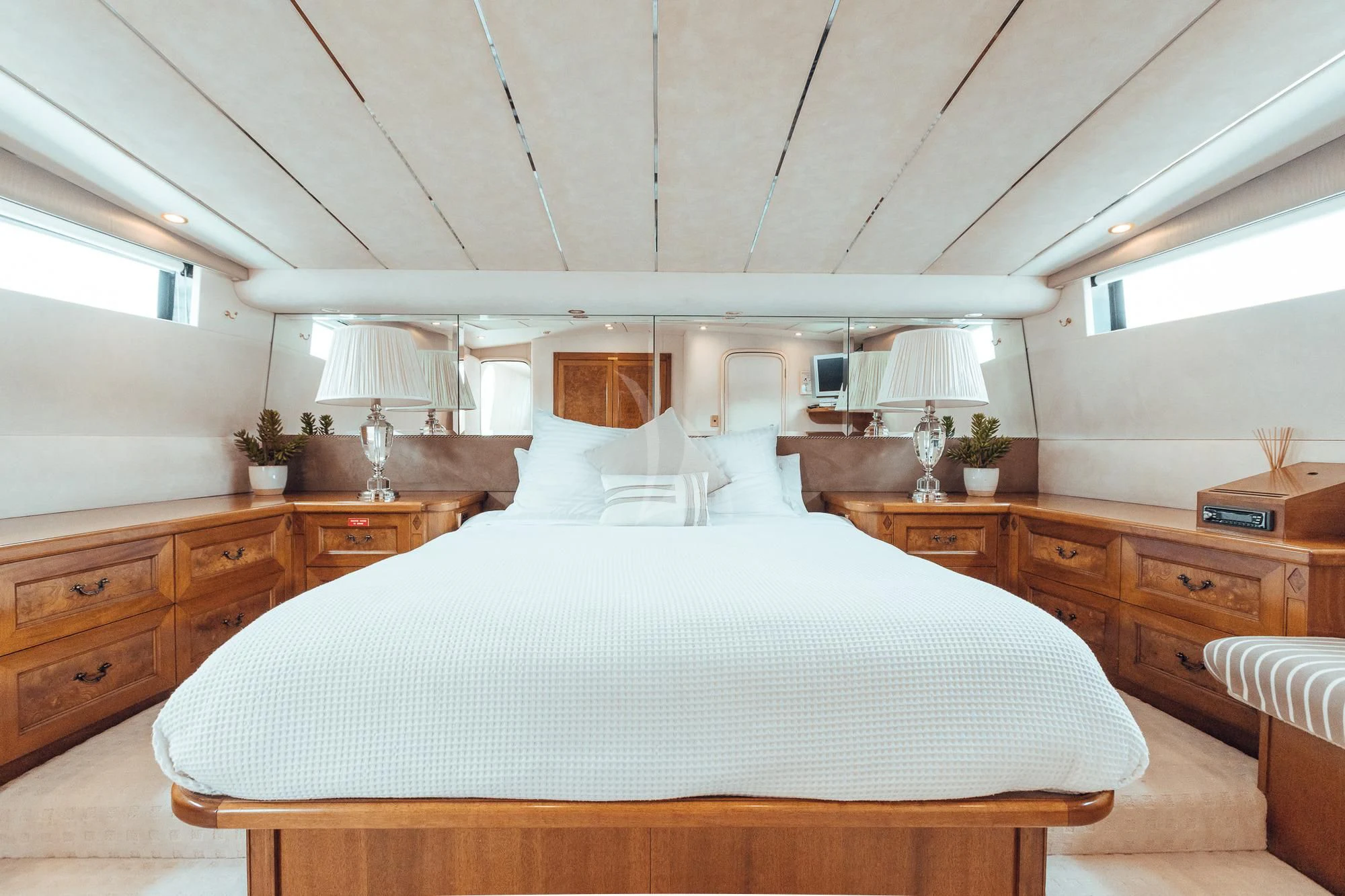 a large bedroom with a large bed aboard OSCAR II Yacht for Sale