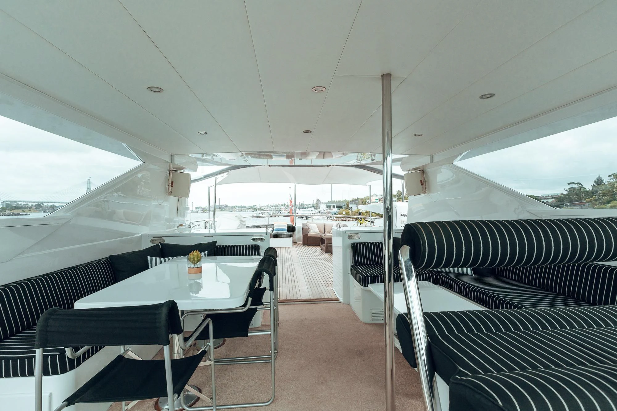 a boat with a table and chairs aboard OSCAR II Yacht for Sale