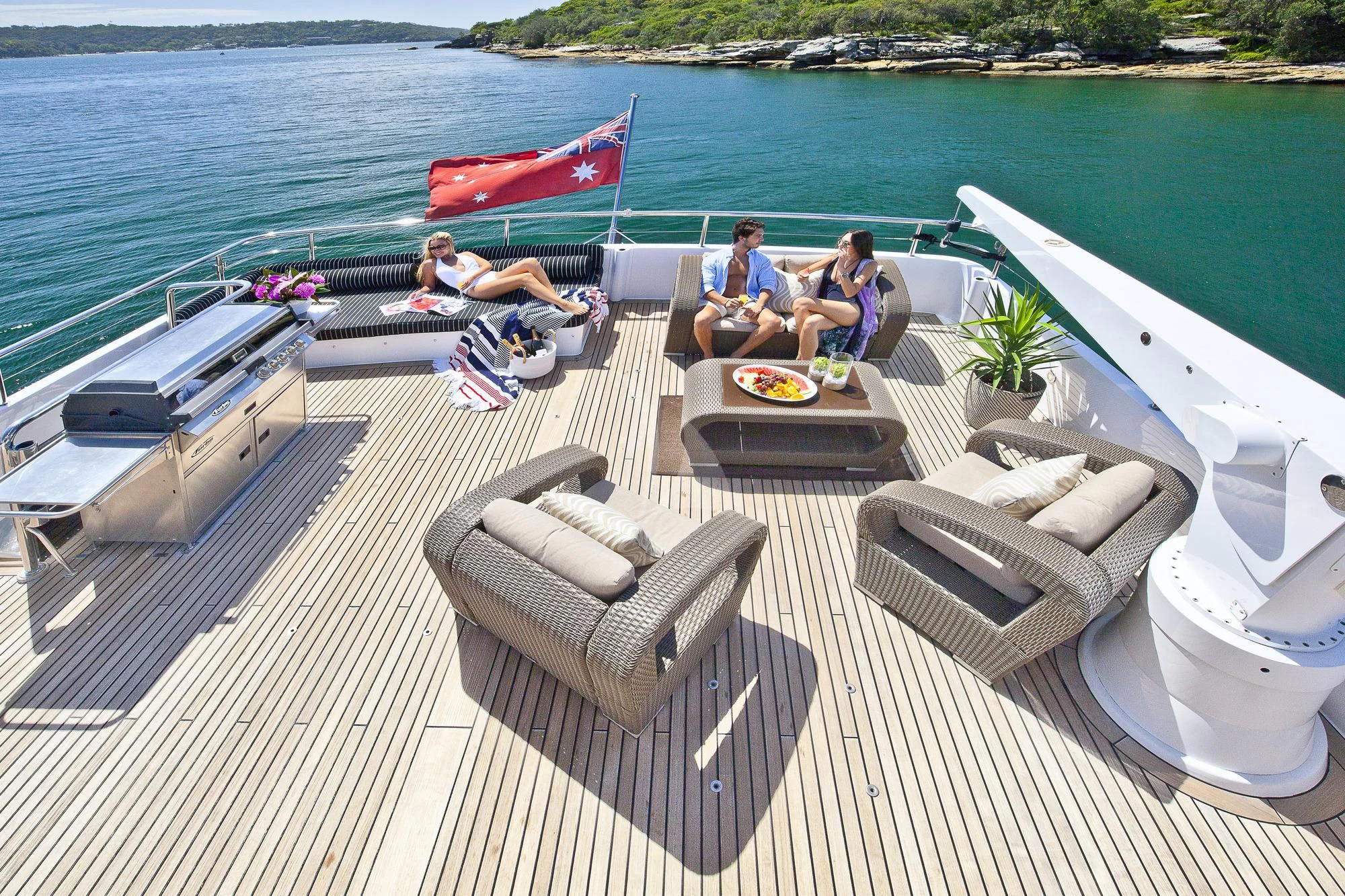 a group of people sitting on a deck on a boat aboard OSCAR II Yacht for Sale
