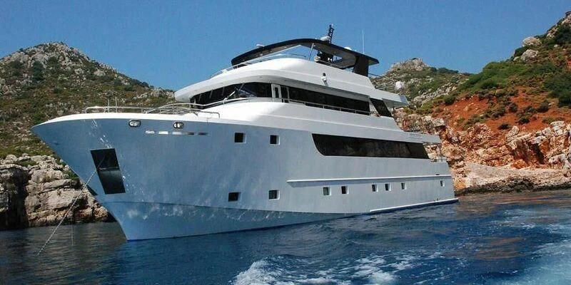 a white yacht on the water aboard IVAR Yacht for Sale