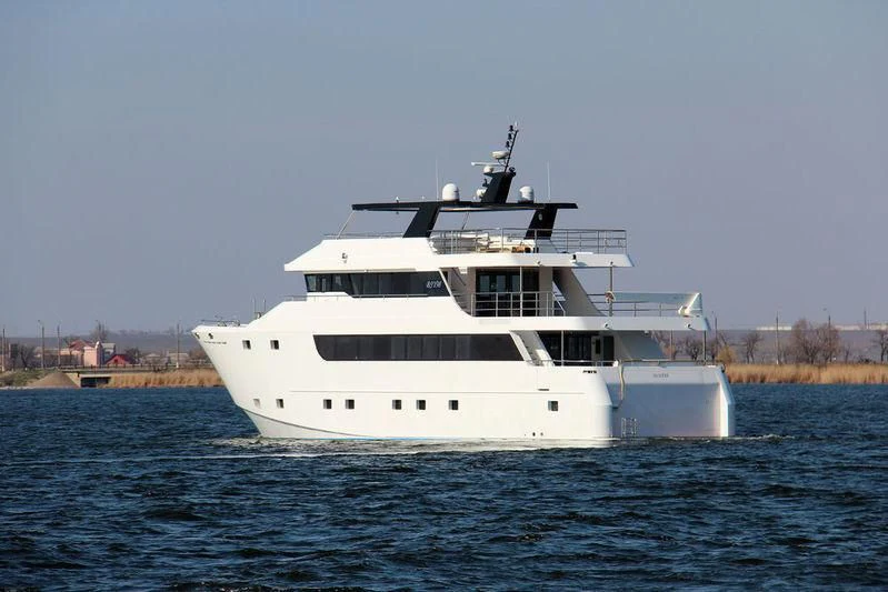 a white boat in the water aboard IVAR Yacht for Sale
