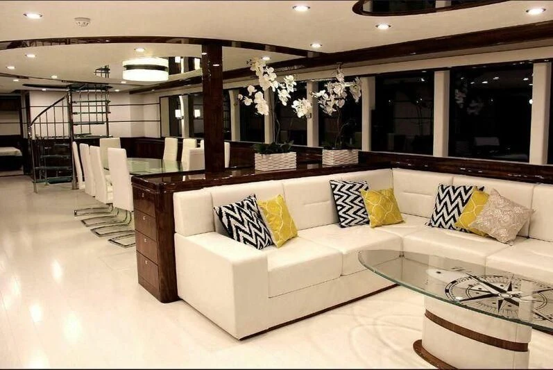 a large living room with a large glass wall aboard IVAR Yacht for Sale