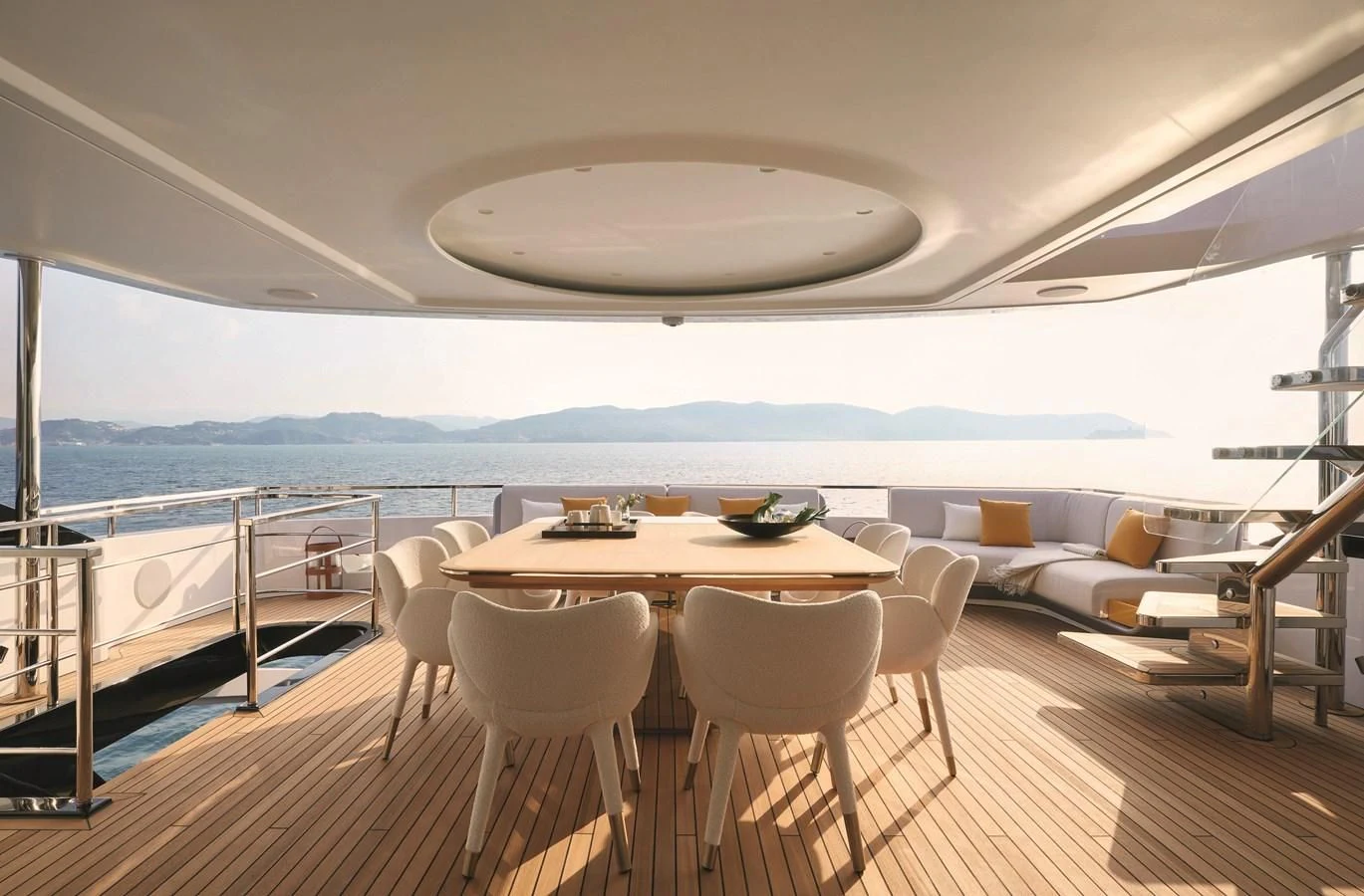 a table and chairs on a deck aboard R.DARENBEN Yacht for Sale