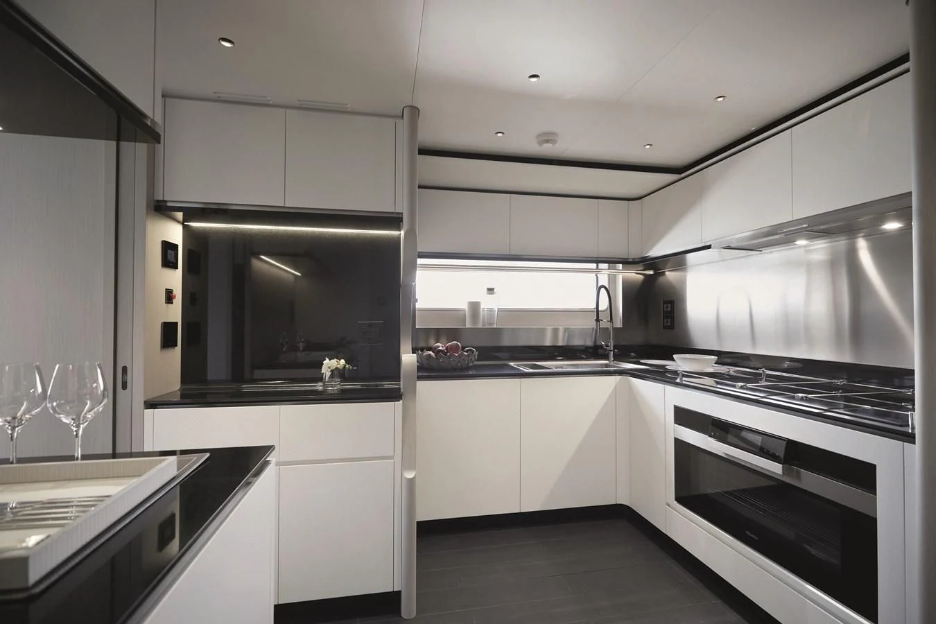 a kitchen with white cabinets aboard R.DARENBEN Yacht for Sale