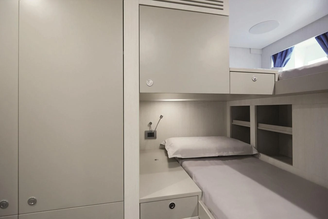 a room with a bed and cabinets aboard R.DARENBEN Yacht for Sale