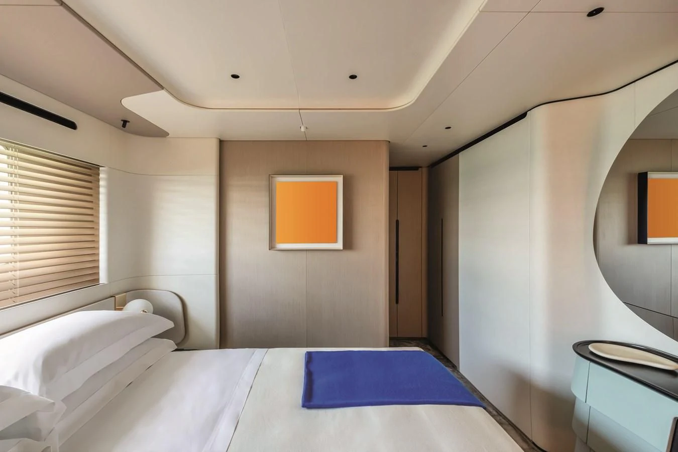 a room with a bed and a mirror aboard R.DARENBEN Yacht for Sale