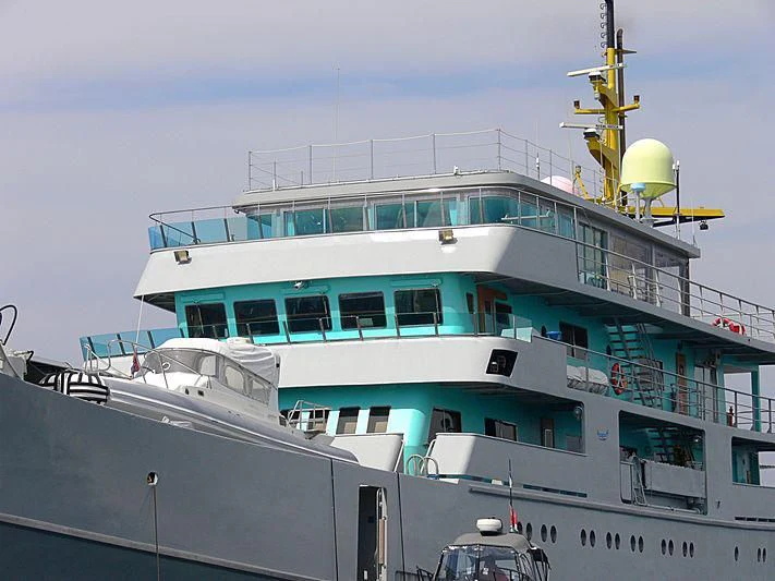 a large white boat with a crane on top aboard MY BROTHER BRANCUSI Yacht for Sale