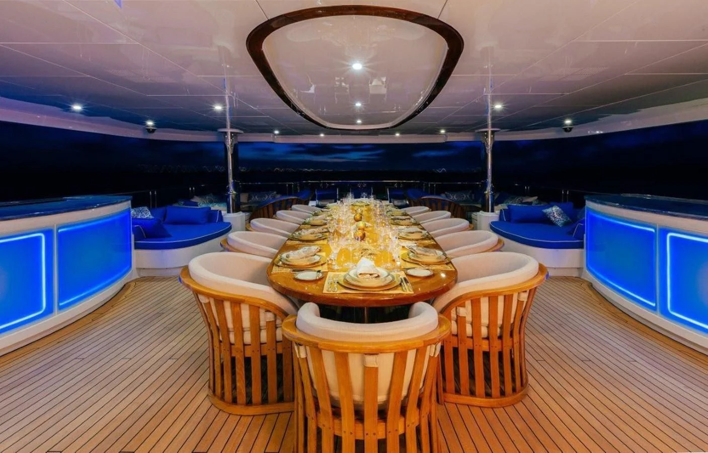 a room with a table and chairs aboard STARSHIP Yacht for Charter