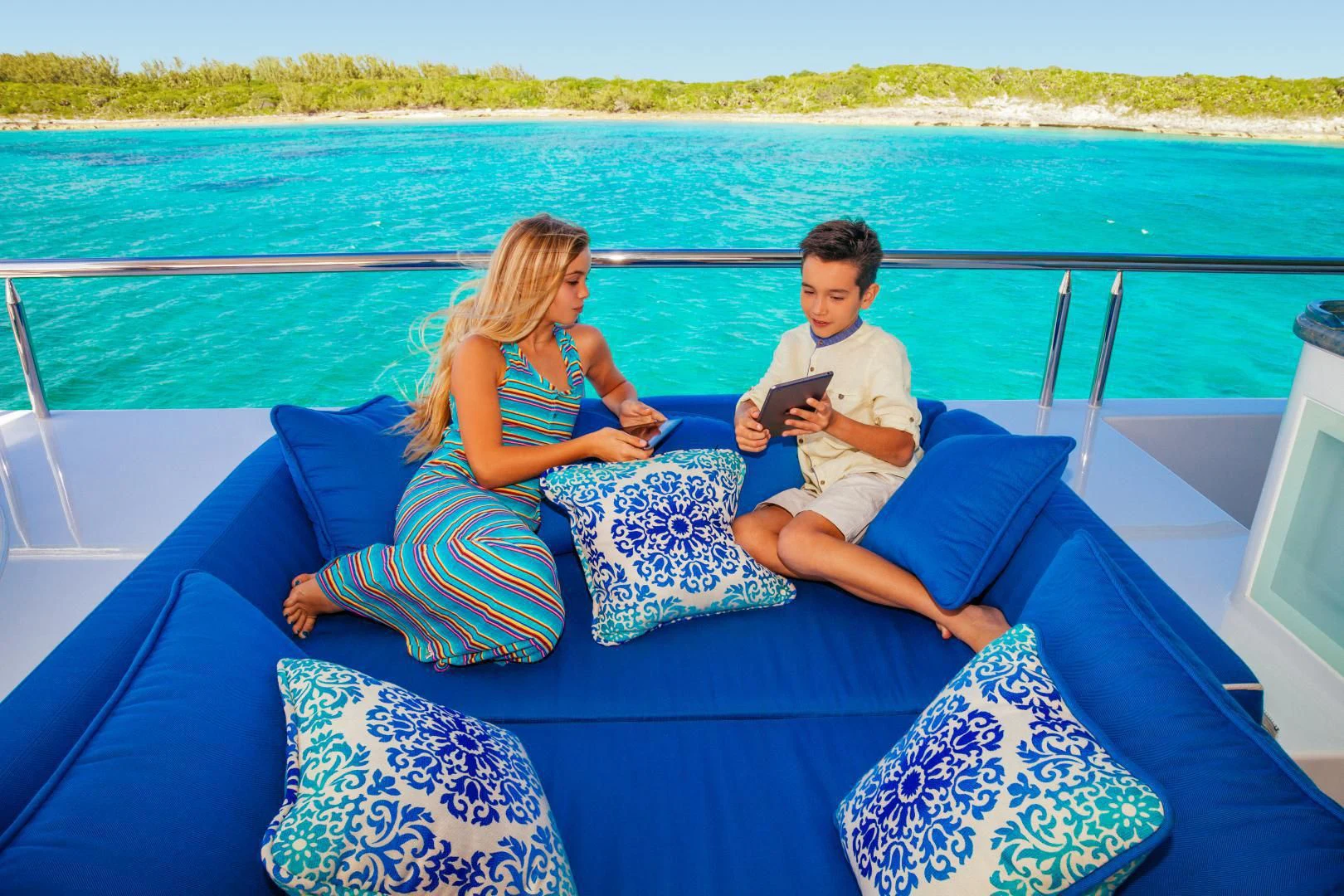 a group of people sitting on a boat aboard STARSHIP Yacht for Charter