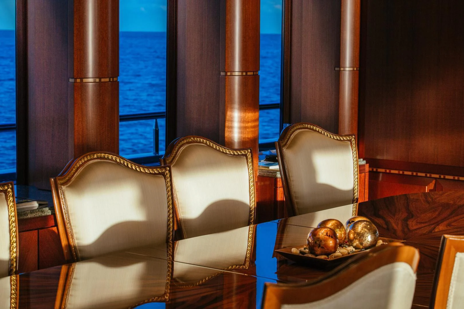 a table with a plate of food on it aboard STARSHIP Yacht for Charter