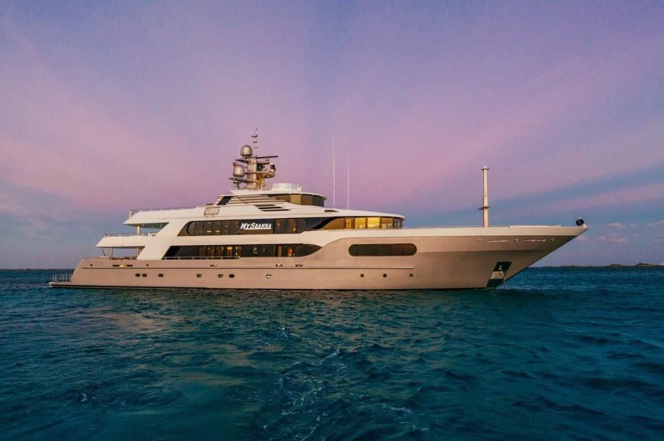 a large white ship in the water aboard STARSHIP Yacht for Charter