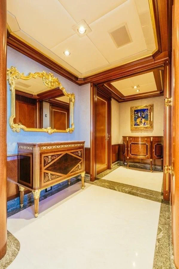 a large room with a mirror and a bench aboard STARSHIP Yacht for Charter