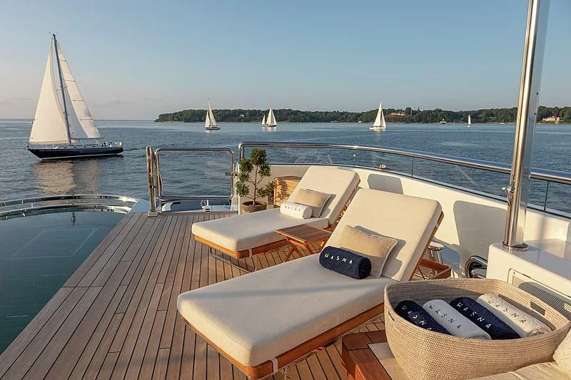 a deck with a laptop and a laptop on it aboard LUNASEA Yacht for Sale
