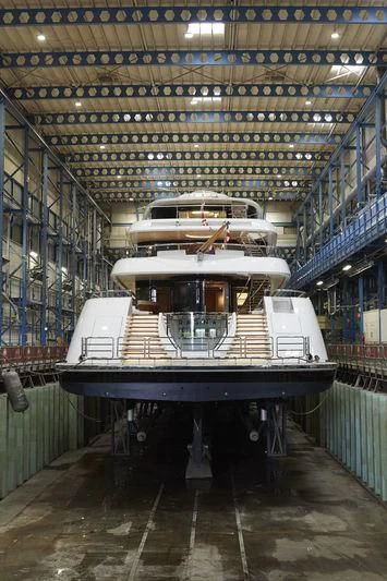 a large boat in a warehouse aboard LUNASEA Yacht for Sale