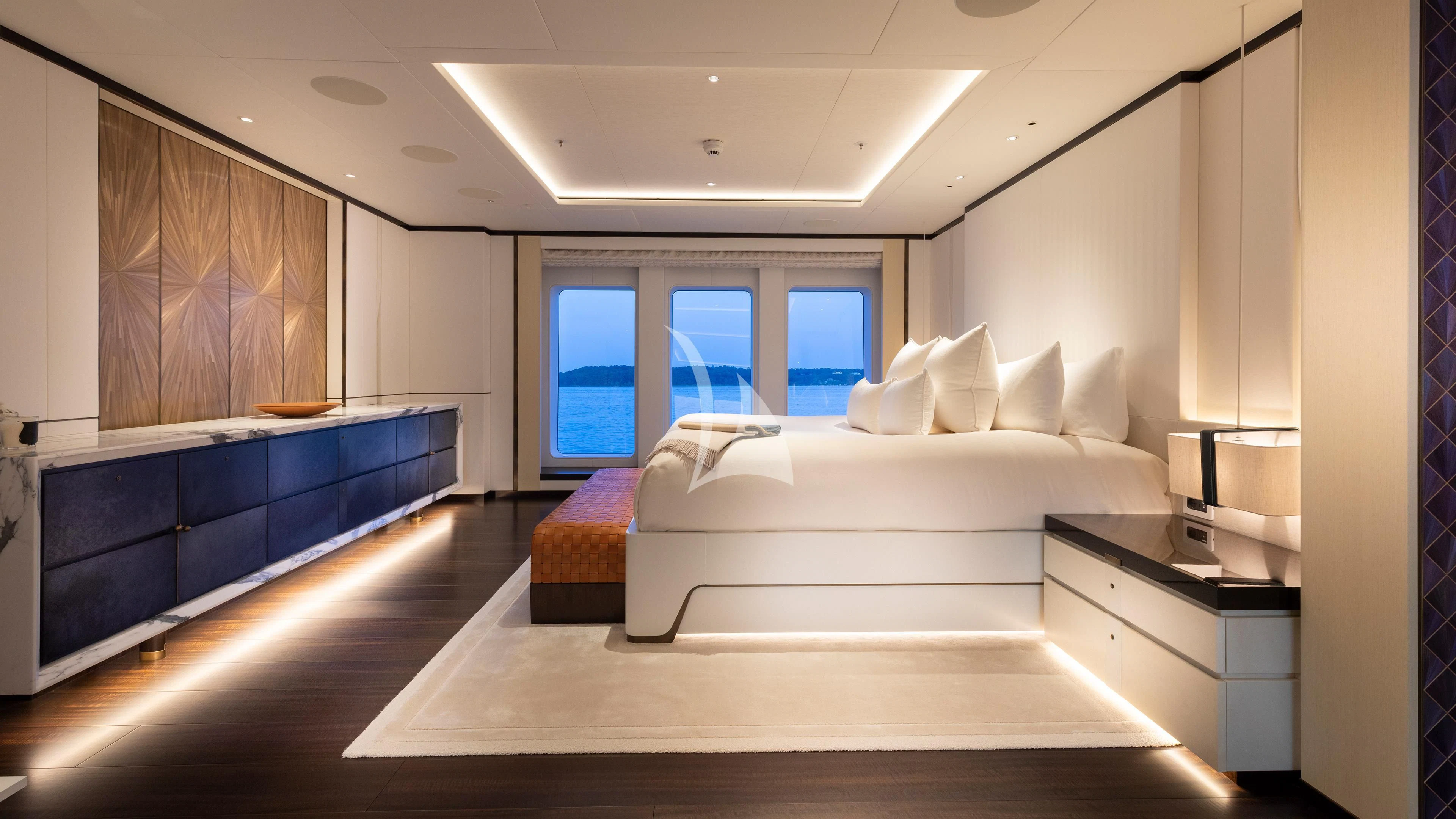a room with a bed and a desk aboard LUNASEA Yacht for Sale