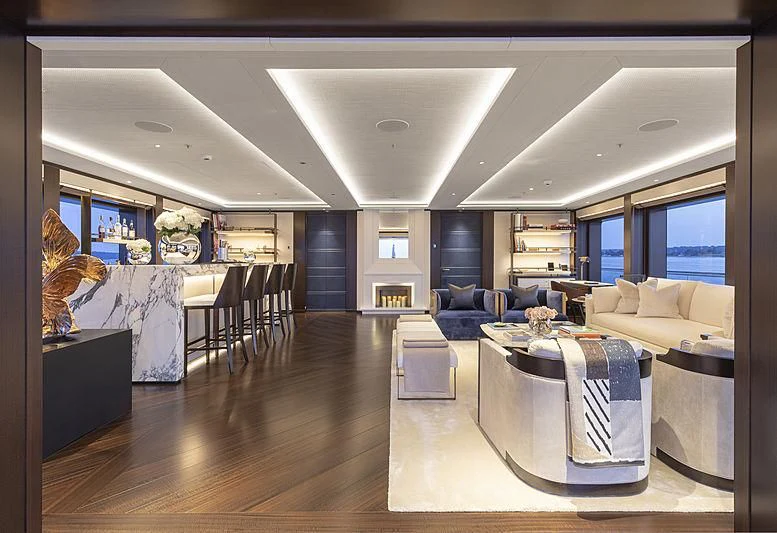 a large living room with a wood floor aboard LUNASEA Yacht for Sale